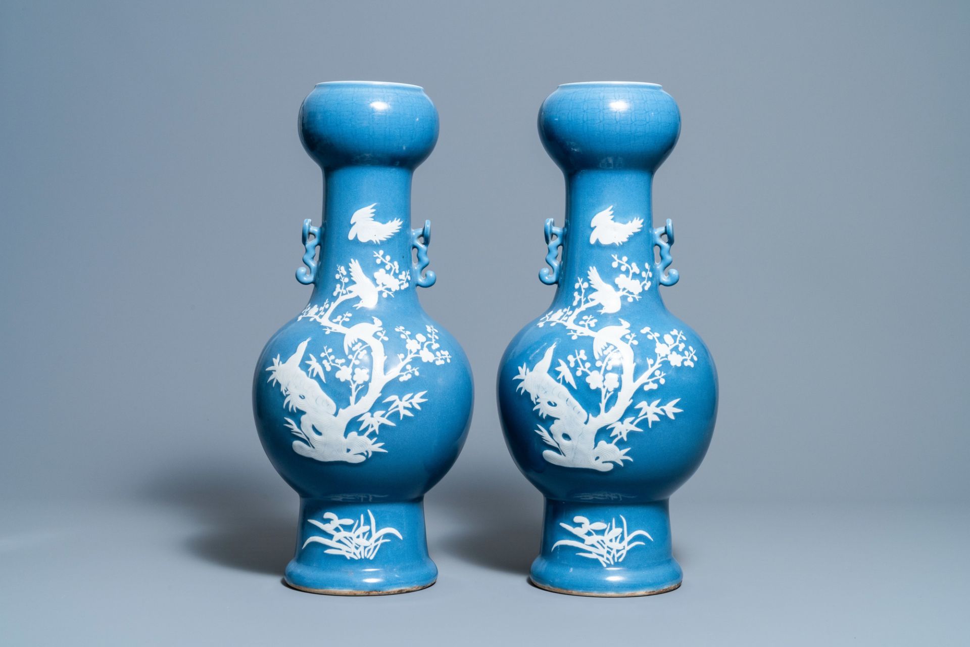 A pair of Chinese white slip-decorated blue-ground vases, 19th C. - Image 3 of 6