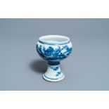 A Chinese blue and white stem cup with a continuous landscape scene, Kangxi/Yongzheng