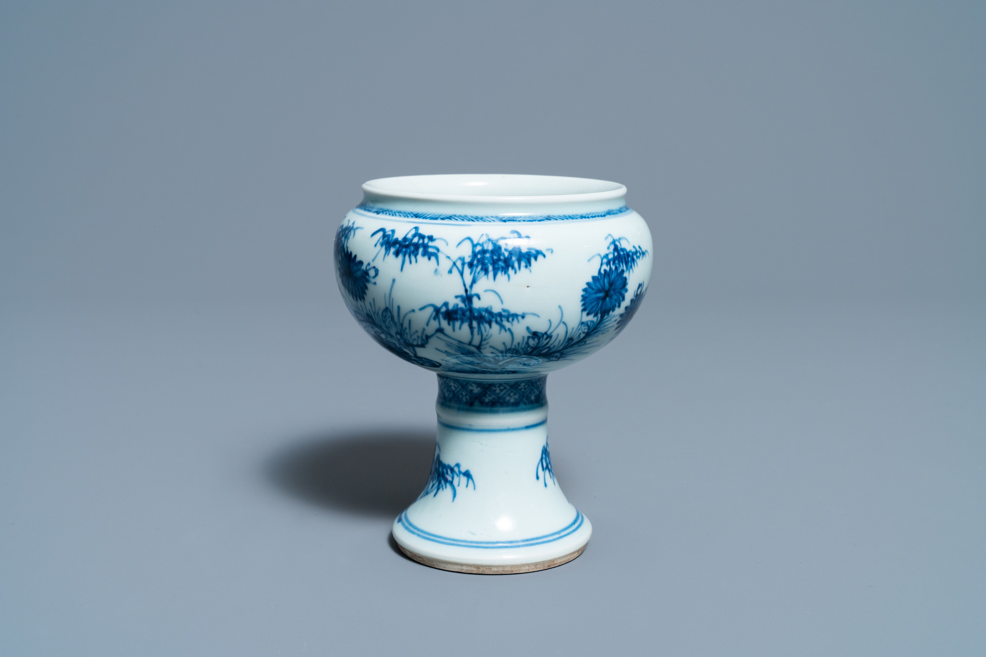 A Chinese blue and white stem cup with floral design, Kangxi/Yongzheng