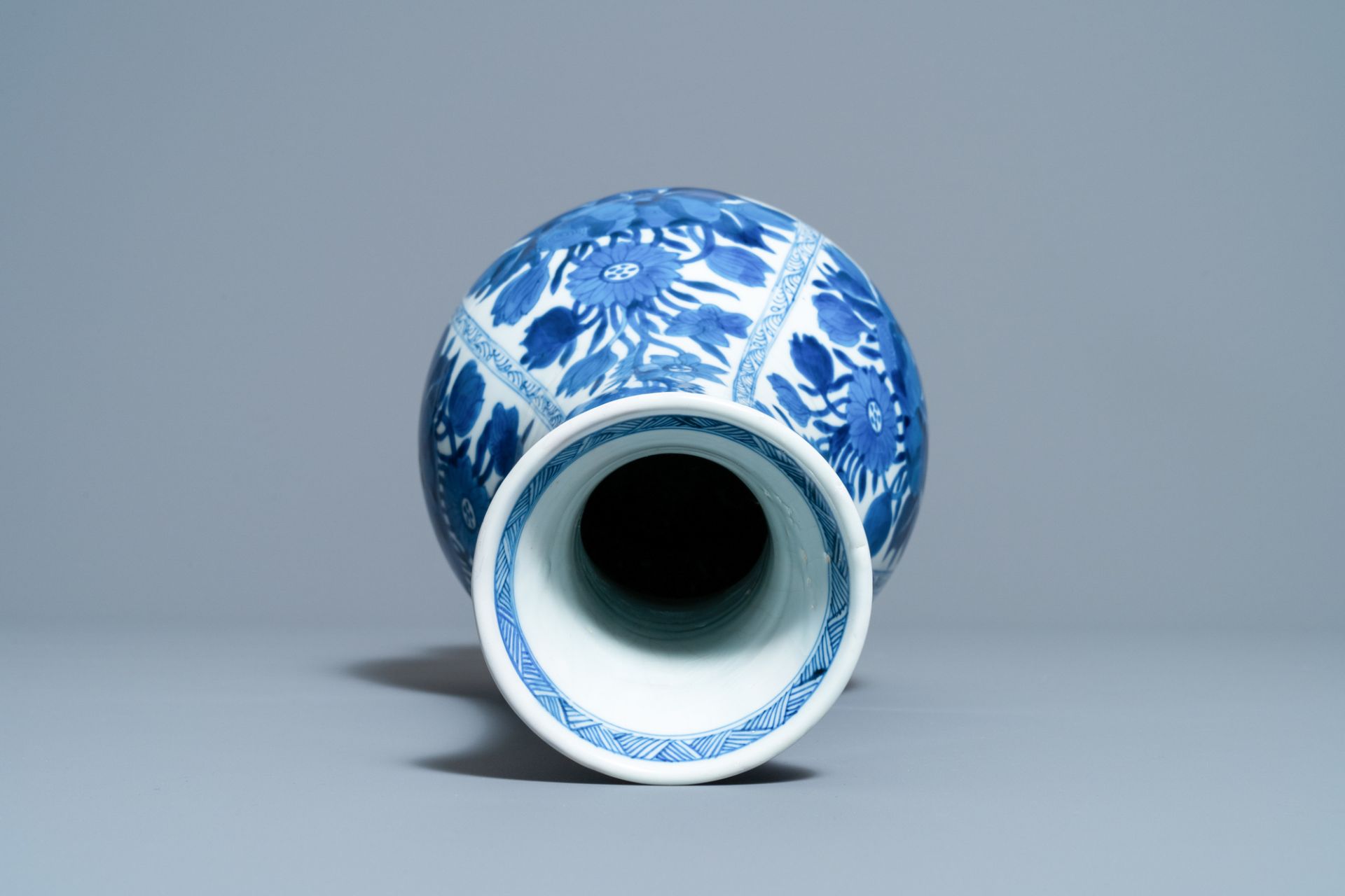 A Chinese blue and white bottle vase with flower arrangements, Kangxi - Image 5 of 6