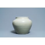 A globular Chinese monochrome celadon 'dragon' vase, Kangxi