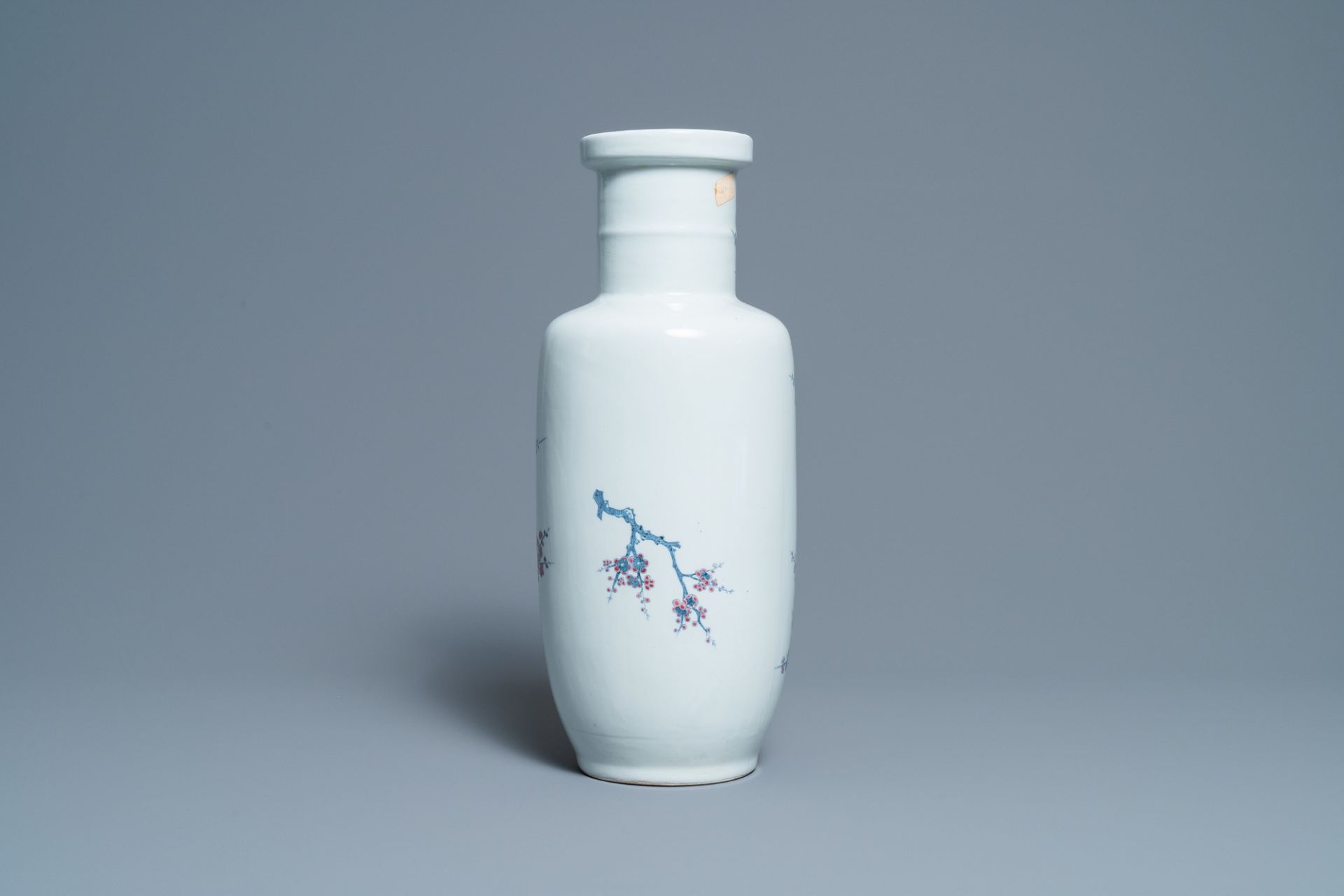 A Chinese blue, white and copper-red rouleau vase with birds among blossoming branches, 20th C. - Image 3 of 6