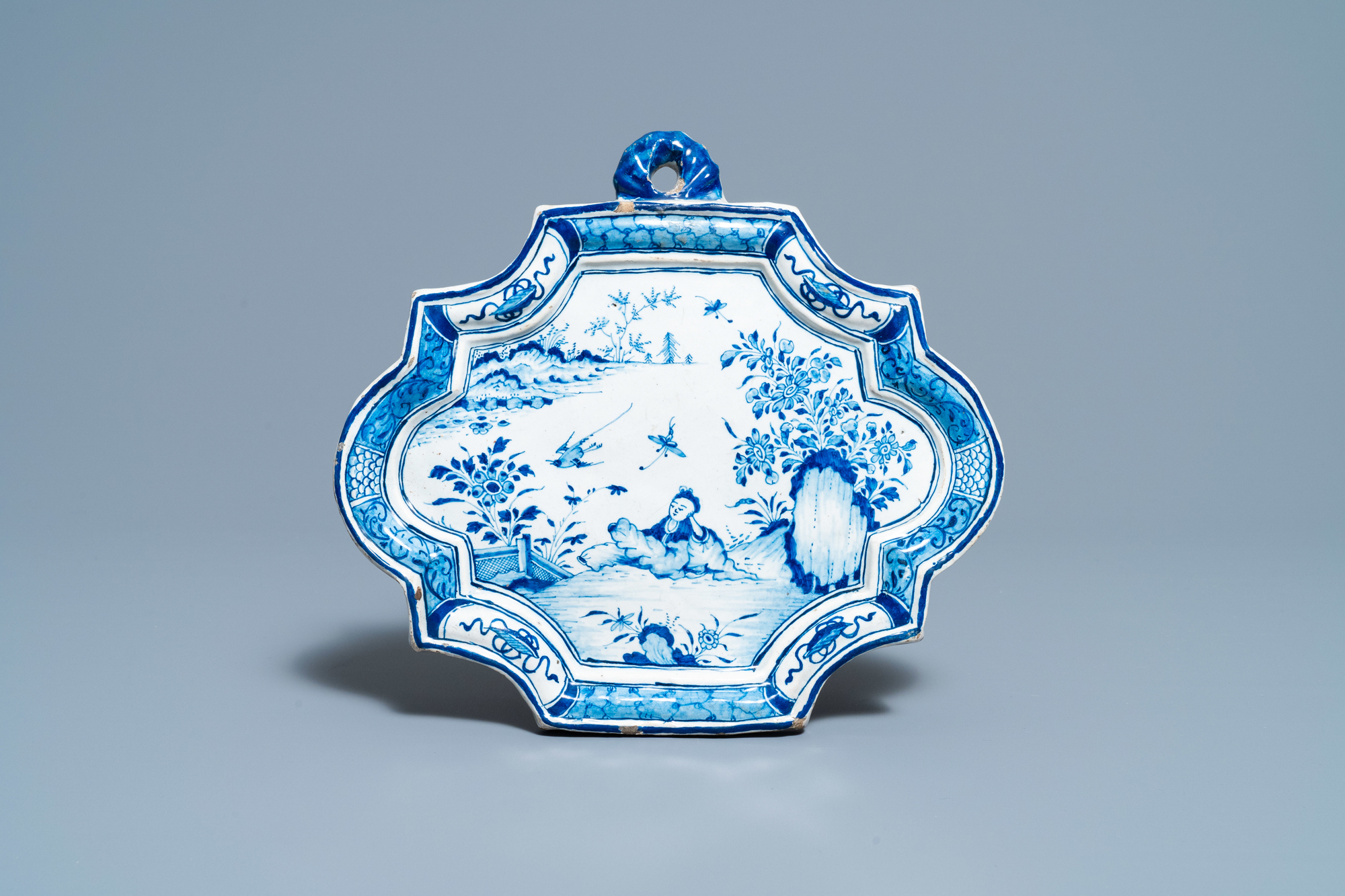 A Dutch Delft blue and white chinoiserie plaque, 18th C.