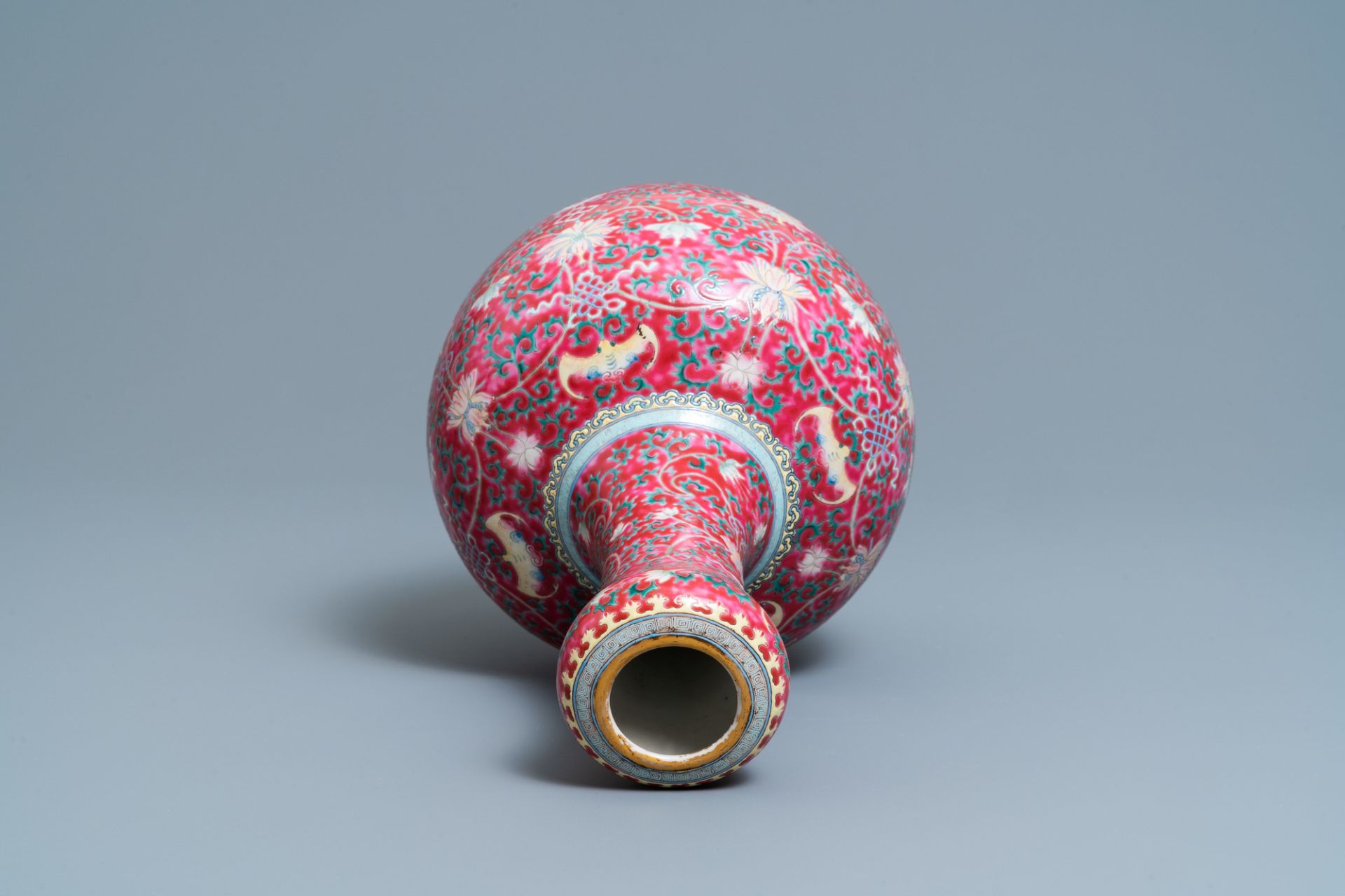 A Chinese famille rose ruby-ground bottle vase, Qianlong mark, 19/20th C. - Image 5 of 6