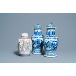 A pair of Chinese blue and white vases and a famille rose jar and cover, 19/20th C.