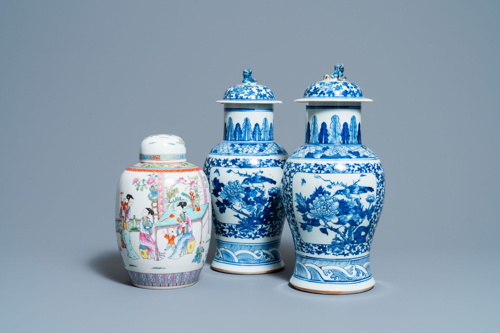 A pair of Chinese blue and white vases and a famille rose jar and cover, 19/20th C.