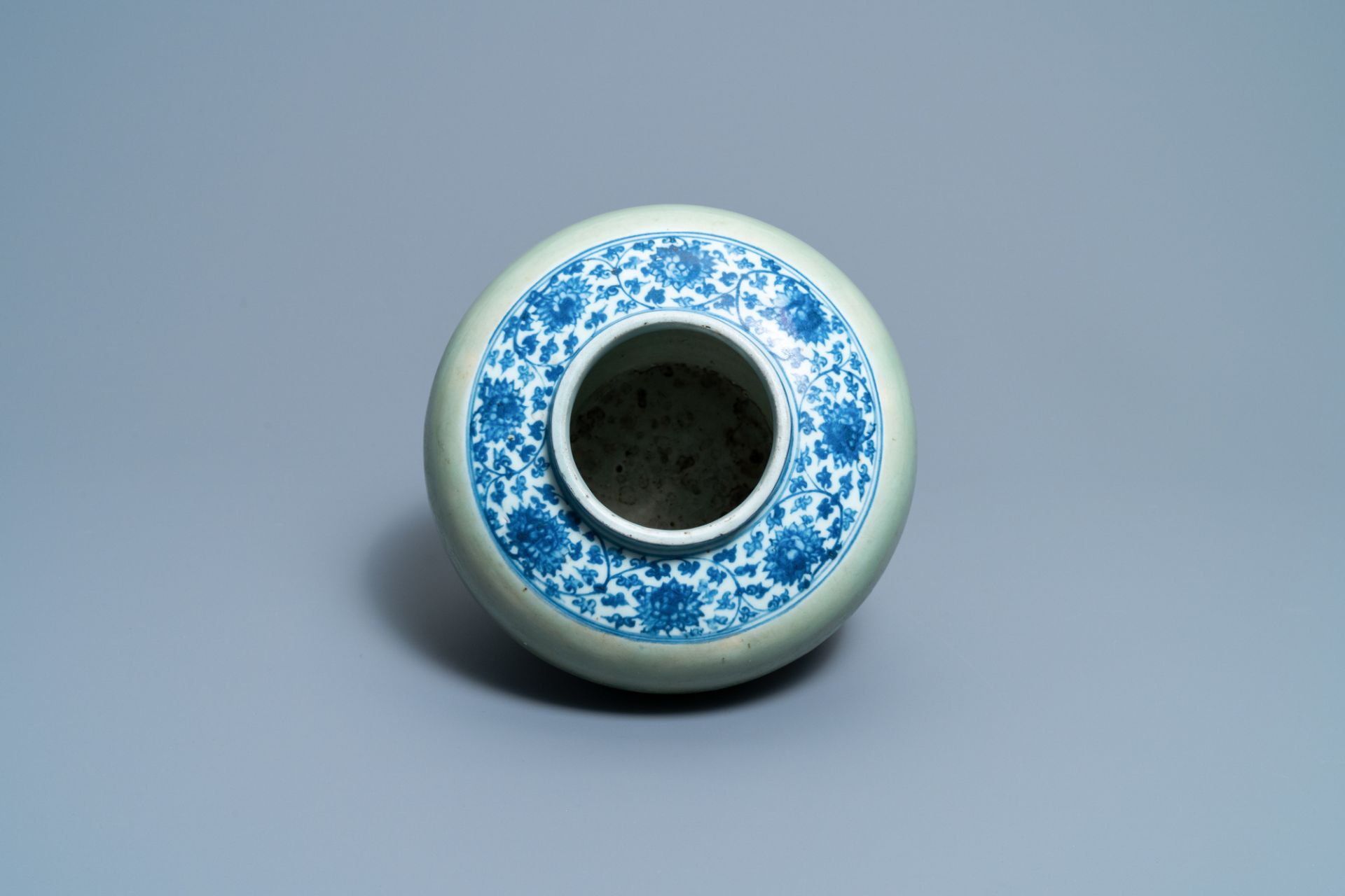 A Chinese celadon-ground and blue and white 'lotus scroll' jar, Ming - Image 6 of 7