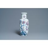 A Chinese blue, white and copper-red rouleau vase with birds among blossoming branches, 20th C.