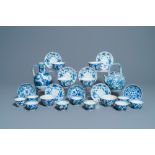 A collection of Chinese and Japanese blue and white cups and saucers and two ewers, Wanli and later