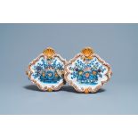 A pair of polychrome Dutch Delft 'flower basket' plaques, 18th C.