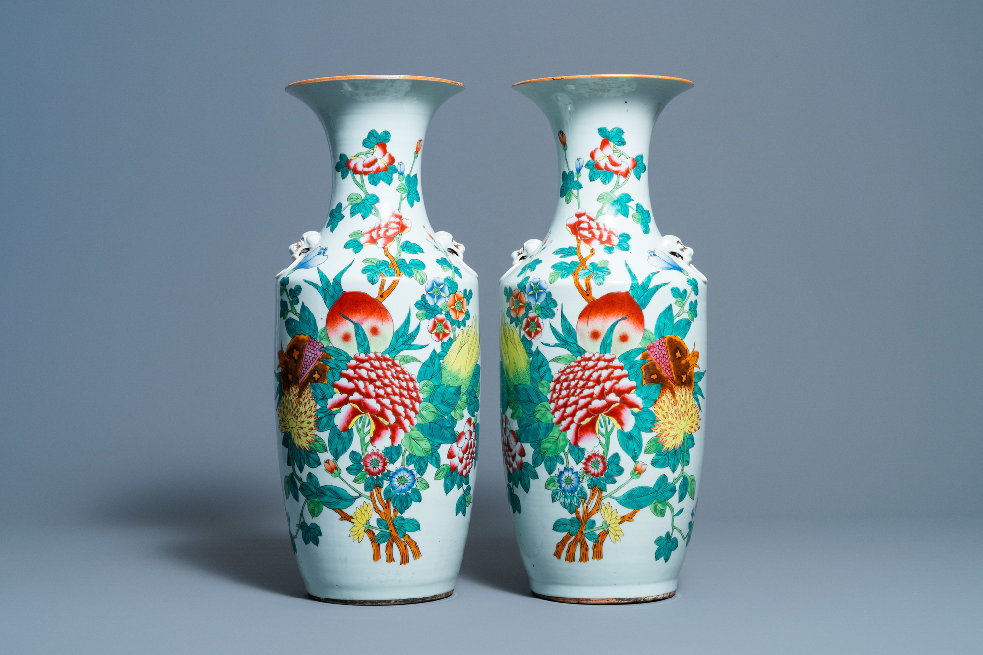 A pair of Chinese famille rose vases with fruits and flowers, 19/20th C.