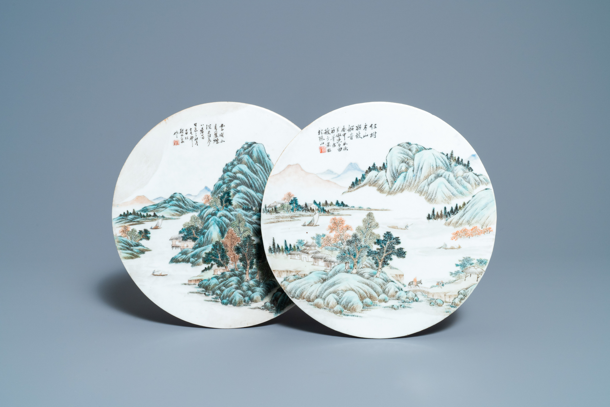 Two round Chinese qianjiang cai 'landscape' plaques, signed Ao Shaoquan and dated 1904