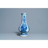 A Chinese blue and white bottle vase with flower arrangements, Kangxi