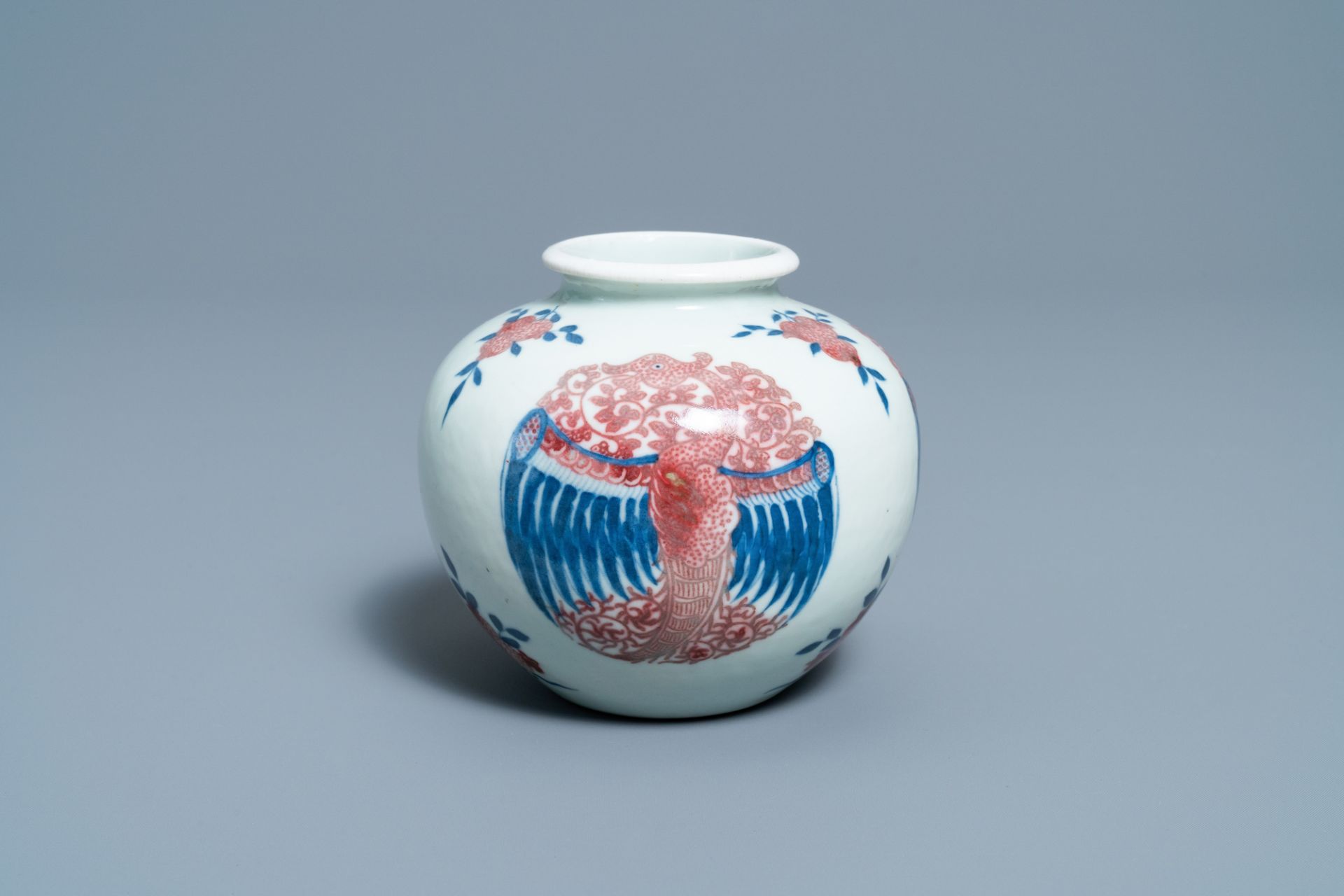 A Chinese blue, white and copper-red 'phoenixes' water pot, Kangxi mark, 19th C.