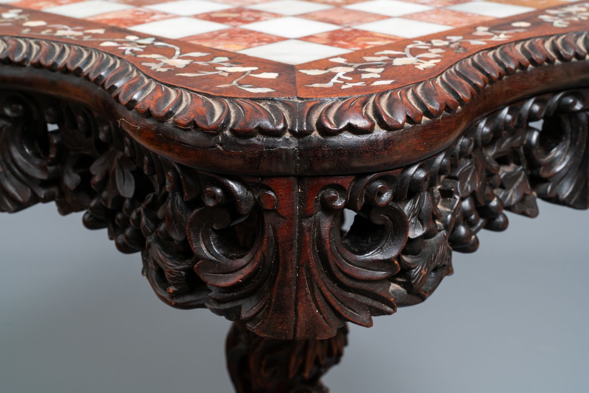 A Chinese carved wooden side table with marble chessboard top, 19th C. - Image 8 of 17