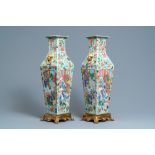 A pair of Chinese square famille rose celadon-ground vases on gilt bronze feet, 19th C.