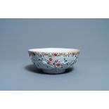 A Chinese famille rose relief-decorated floral bowl, Yongzheng/Qianlong