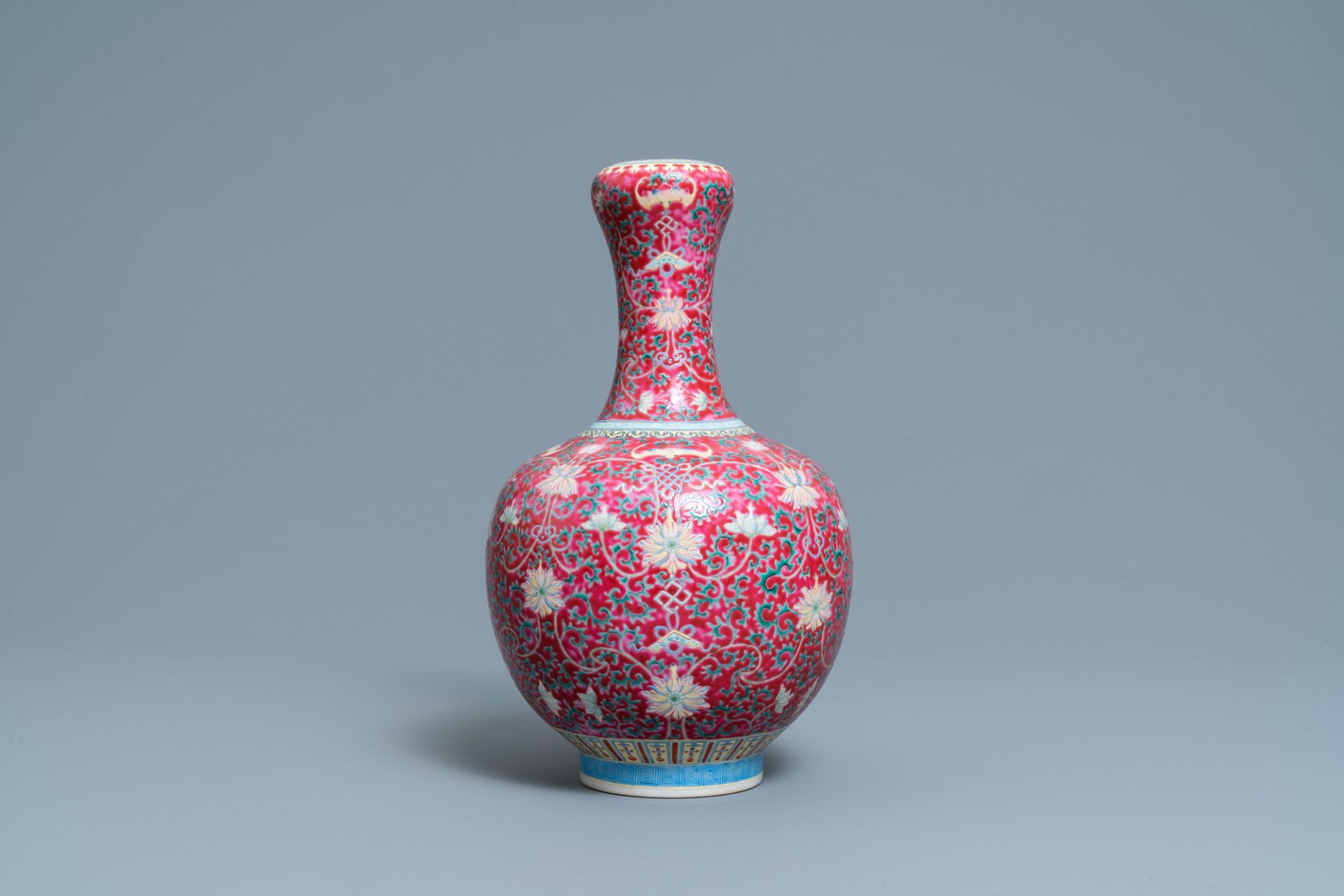 A Chinese famille rose ruby-ground bottle vase, Qianlong mark, 19/20th C. - Image 3 of 6