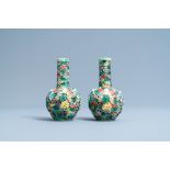 A pair of Chinese reticulated famille verte bottle vases, 19th C.