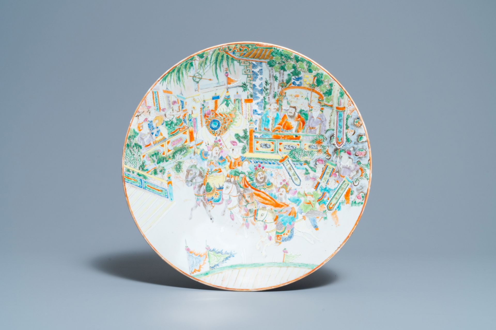 A large Chinese Canton famille rose 'horseriders' dish, 19th C.