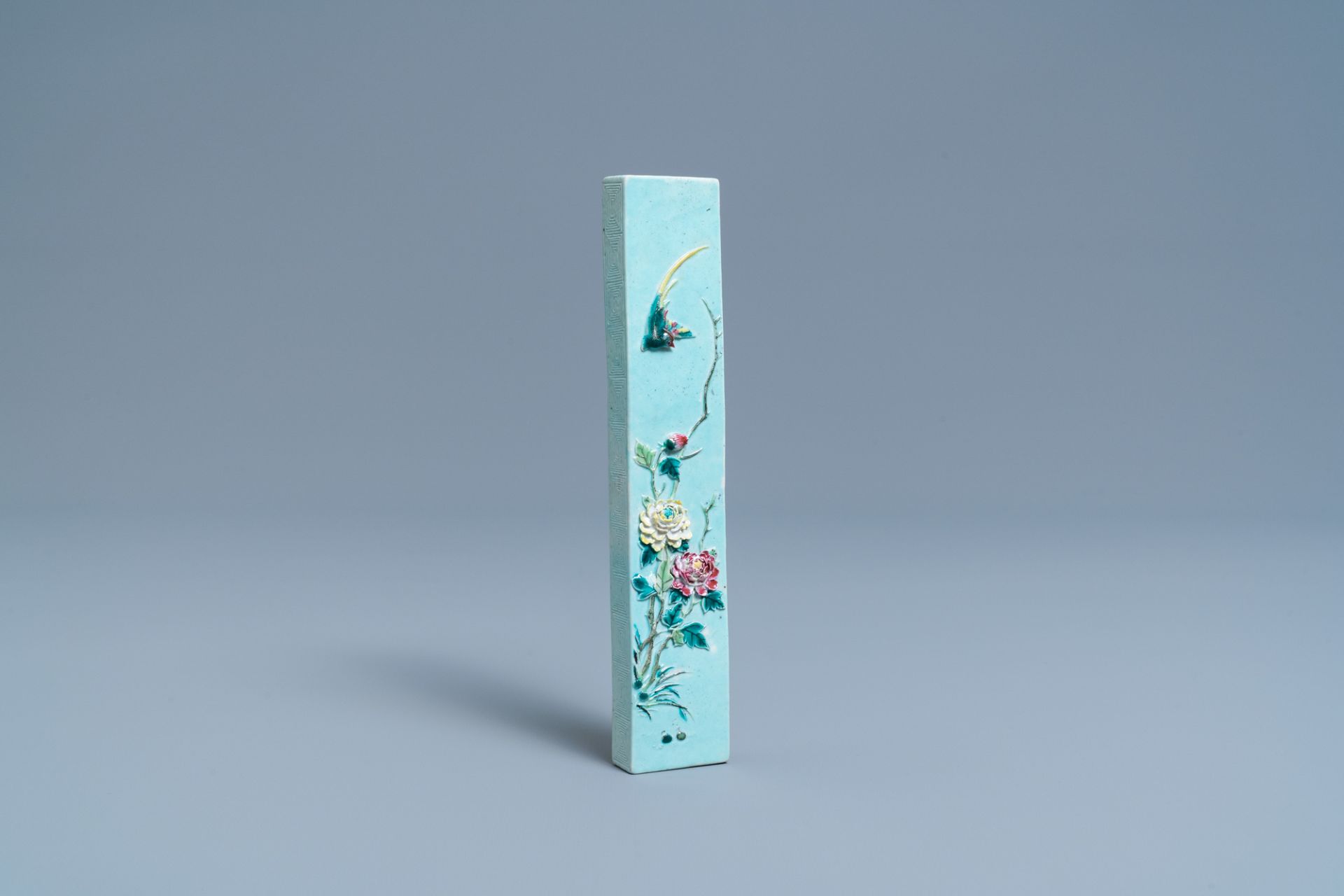 A Chinese famille rose relief-decorated scroll Weight, hall mark, 19th C.