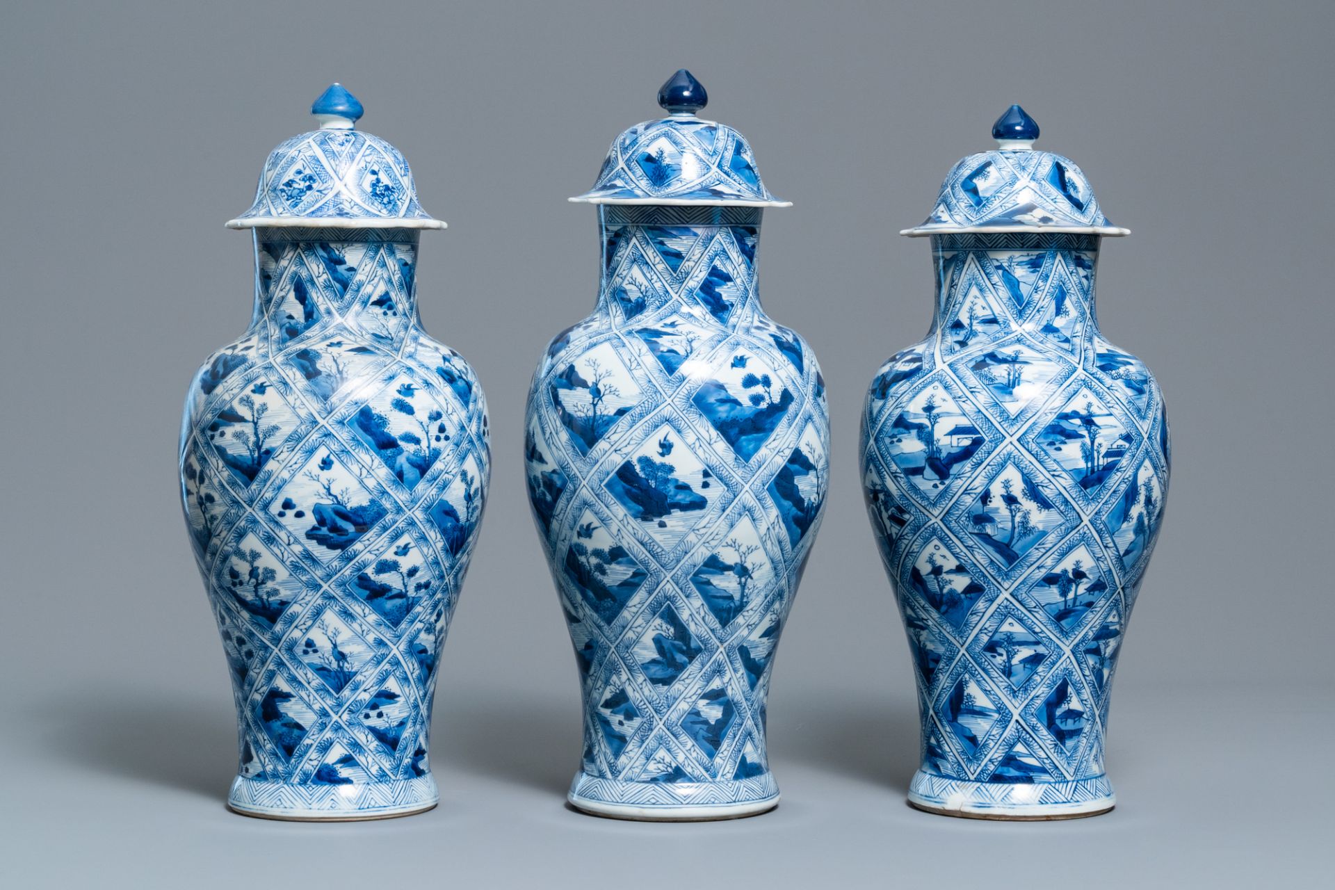 A large Chinese blue and white five-piece garniture with floral and landscape panels, Kangxi - Image 5 of 66