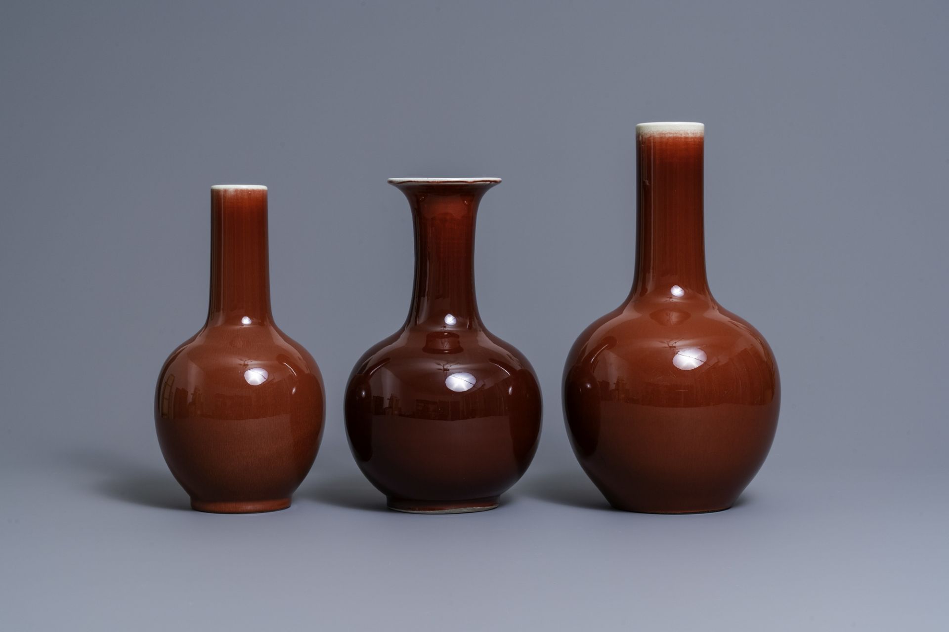 Three Chinese monochrome sang de boeuf-glazed bottle vases, 19/20th C. - Image 4 of 7