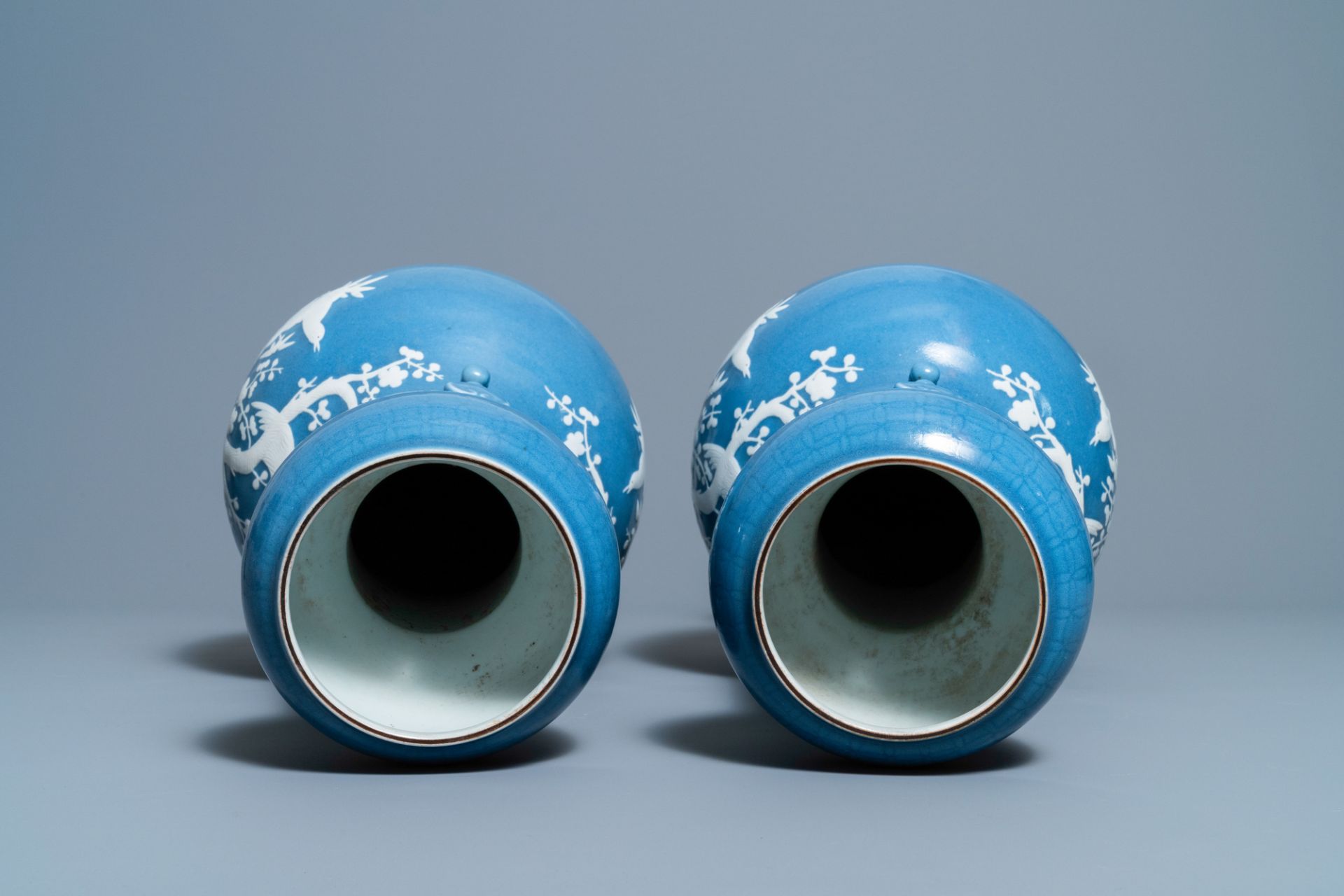 A pair of Chinese white slip-decorated blue-ground vases, 19th C. - Image 5 of 6