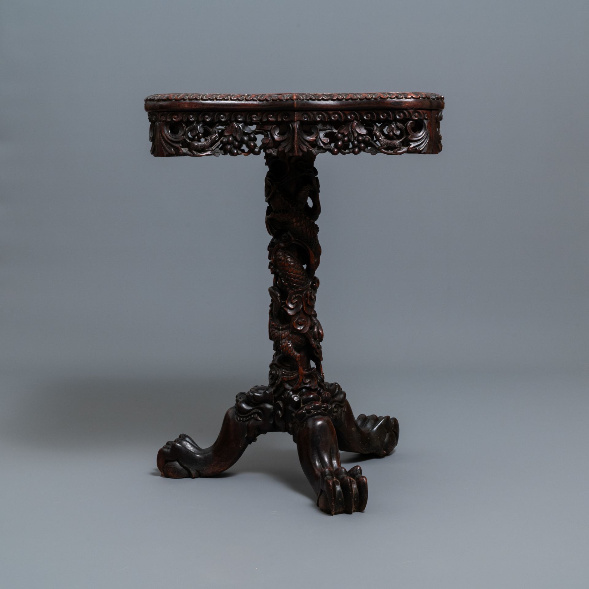 A Chinese carved wooden side table with marble chessboard top, 19th C. - Image 5 of 17