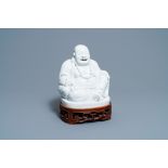 A Chinese Dehua blanc de Chine figure of Buddha, Kangxi
