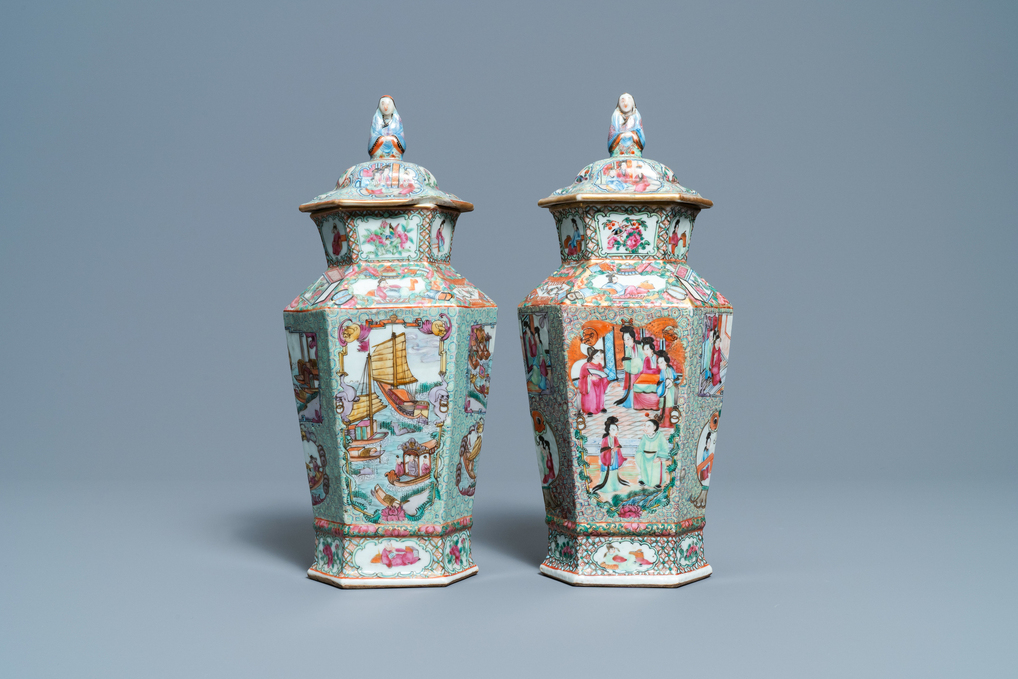 Two Chinese hexagonal Canton famille rose vases and covers, 19th C.