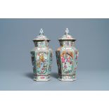 Two Chinese hexagonal Canton famille rose vases and covers, 19th C.