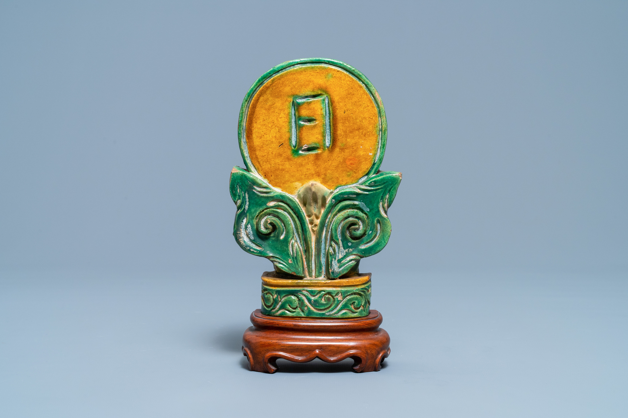 A Chinese sancai-glazed Buddhist emblem on wooden stand, Ming - Image 2 of 7