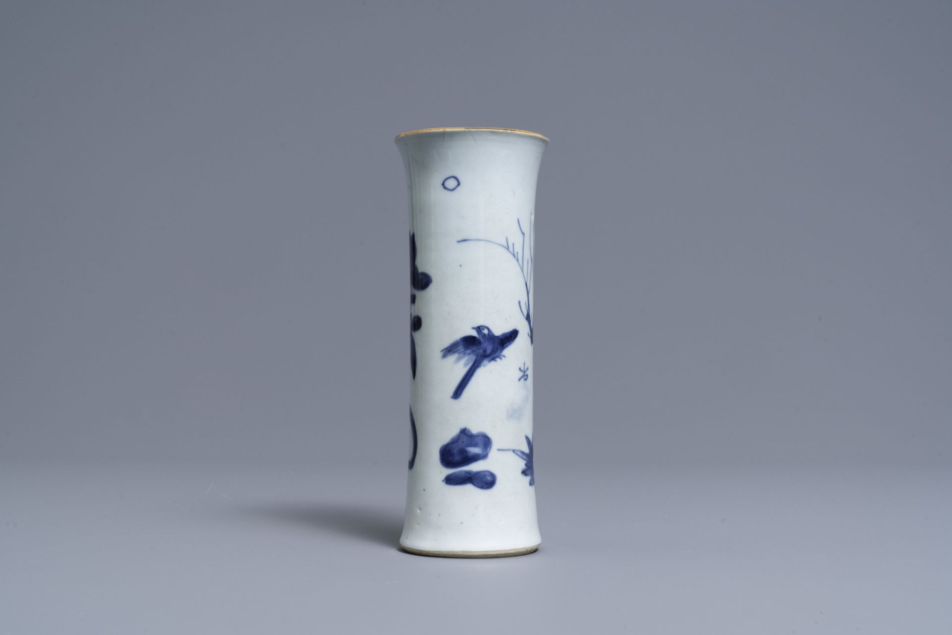 A Chinese blue and white sleeve vase with birds among blossoming branches, Transitional period