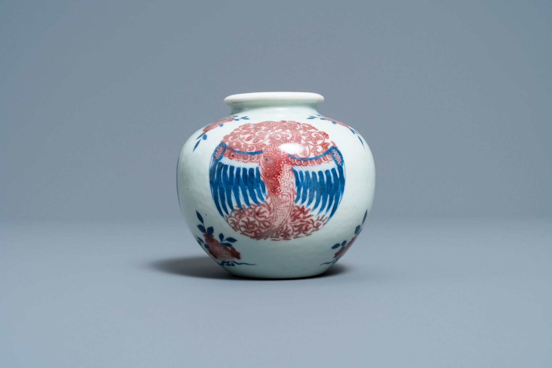 A Chinese blue, white and copper-red 'phoenixes' water pot, Kangxi mark, 19th C. - Image 4 of 7