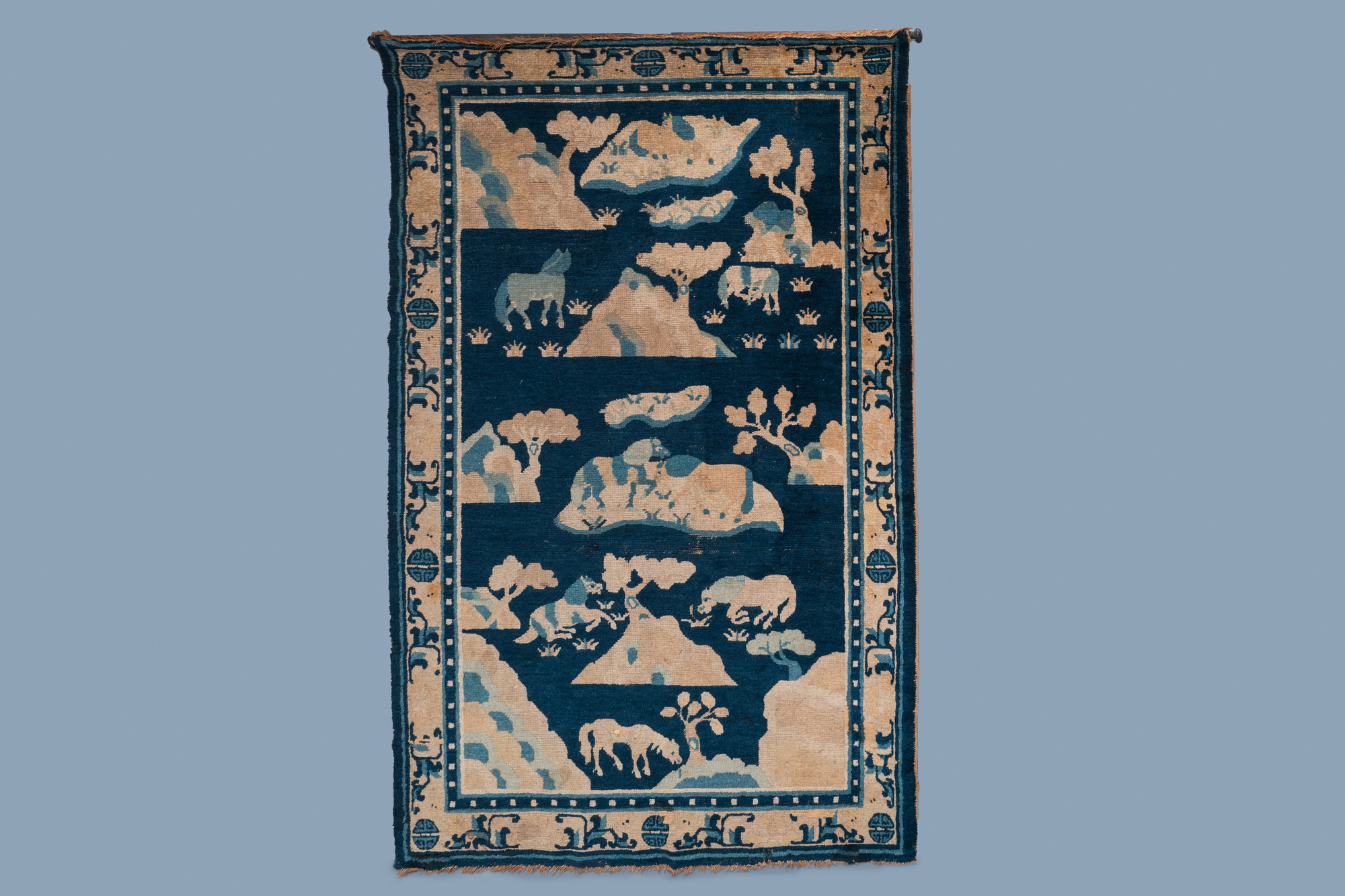 A large Chinese rectangular 'Eight horses of Mu Wang' carpet, 19th C.