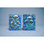 Two polychrome floral relief-moulded tiles, Qajar, Iran, 19th C.