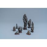 Eight Chinese scholar's rocks on wooden stands, 19/20th C.