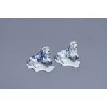 A pair of Dutch Delft blue and white models of lions, 18th C.