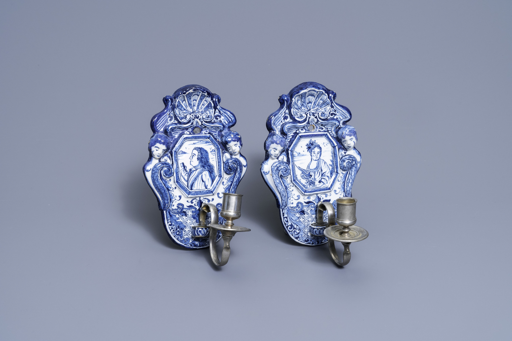 A pair of Dutch Delft blue and white appliques with royalist portraits, 18th C.