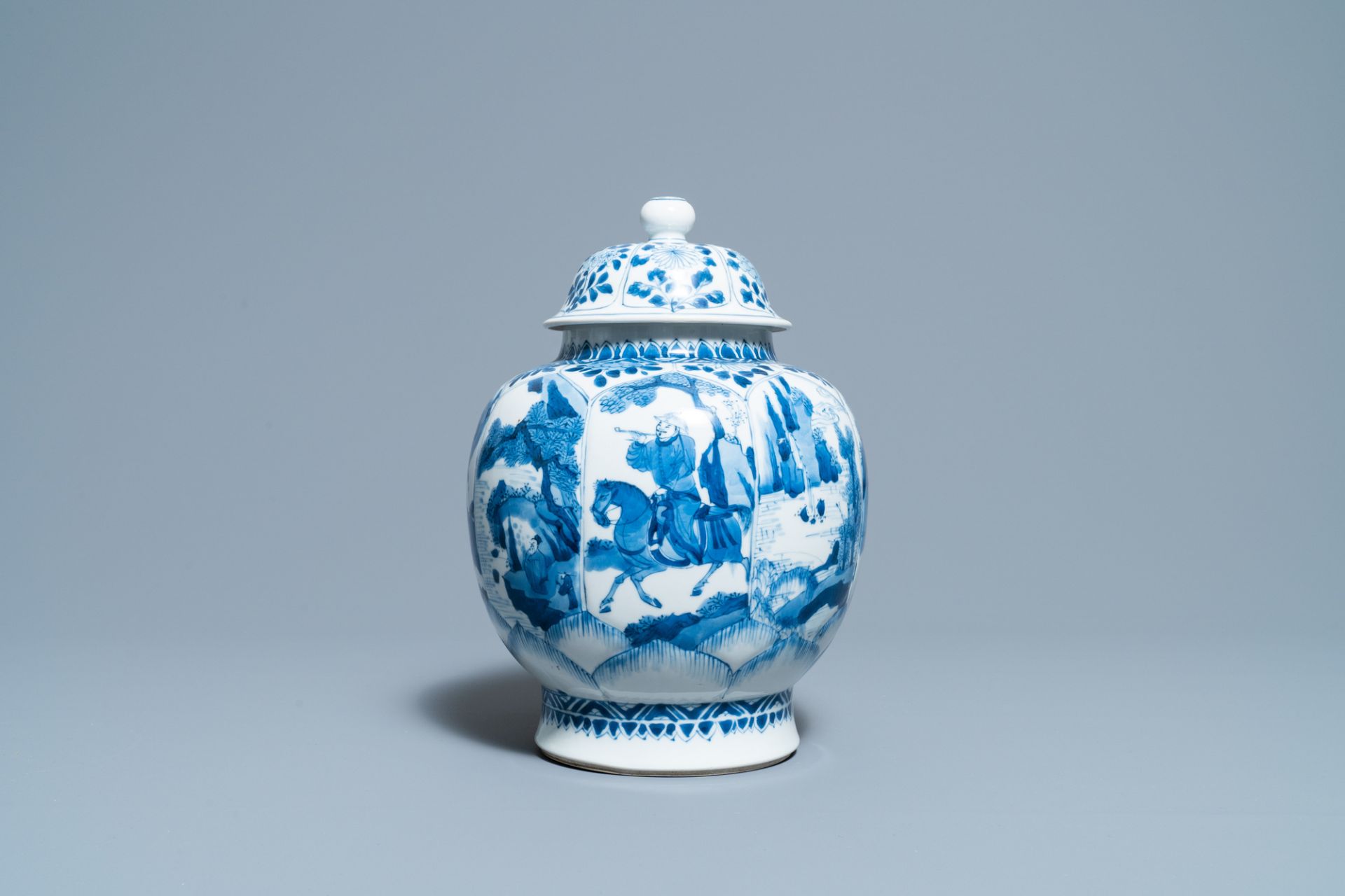 A Chinese blue and white 'horseriders' vase and cover, Kangxi