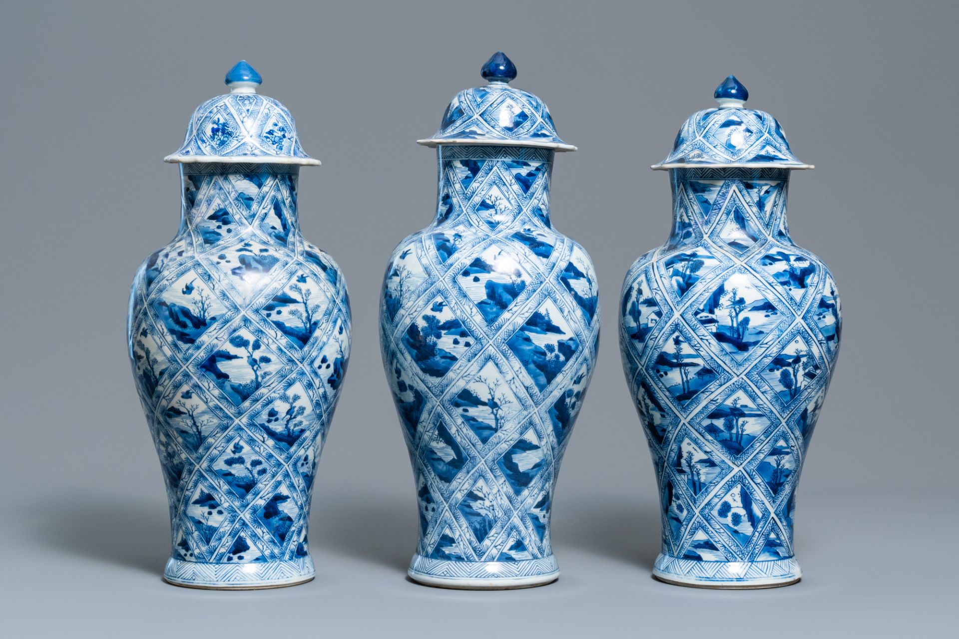 A large Chinese blue and white five-piece garniture with floral and landscape panels, Kangxi - Image 4 of 66