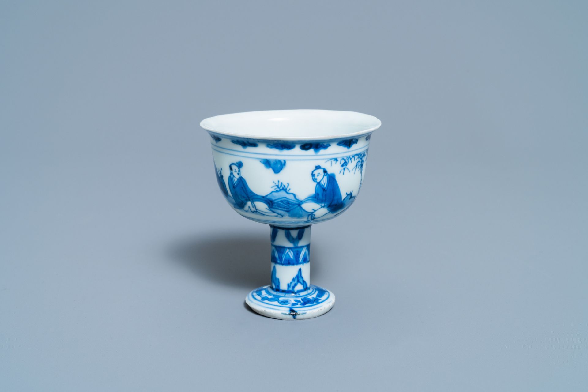 A Chinese blue and white 'go-players' stem cup, Transitional period