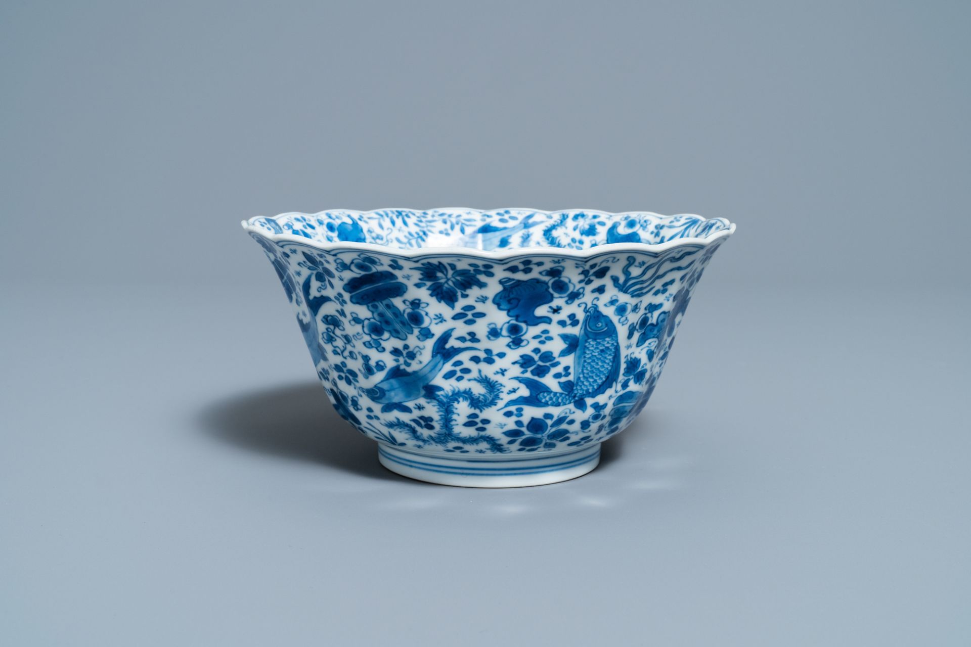 A Chinese blue and white lobed 'carps and crab' bowl, Kangxi