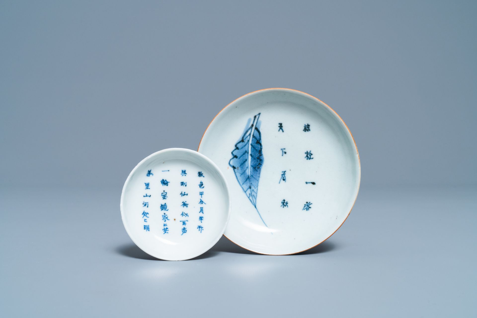 Two Chinese blue and white 'poem' plates, Transitional period/Kangxi