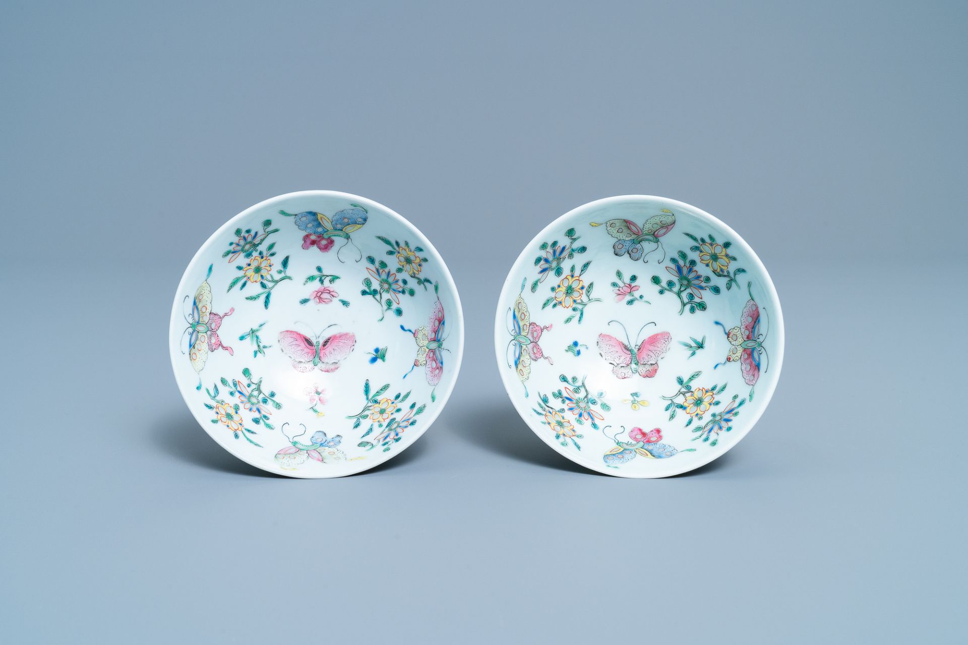 A pair of Chinese famille rose rice grain pattern 'butterfly' bowls, Qianlong mark, 19th C. - Image 5 of 10