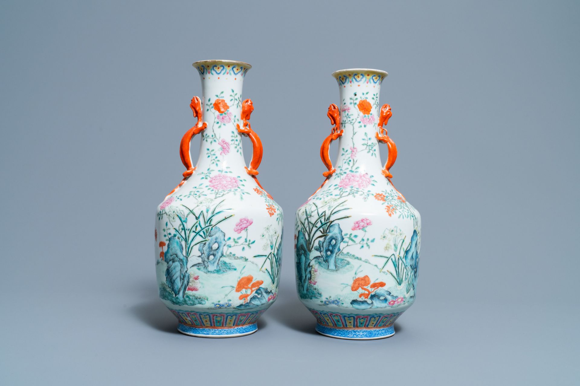A pair of Chinese famille rose 'floral scenery' vases, Jiaqing mark, 19th C.