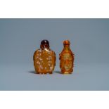 Two Chinese amber-simulating glass snuff bottles, 18/19th C.