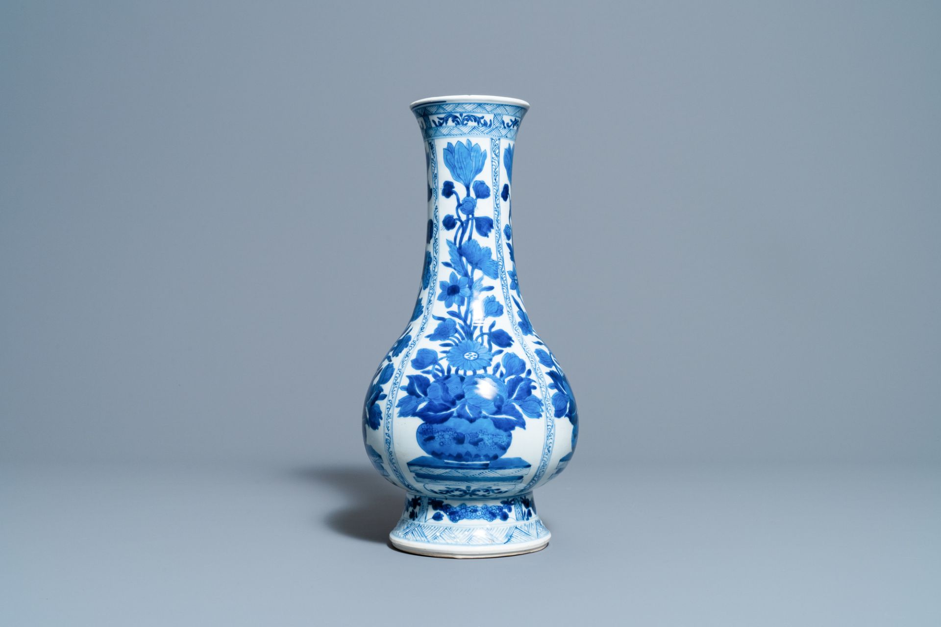 A Chinese blue and white bottle vase with flower arrangements, Kangxi - Image 3 of 6