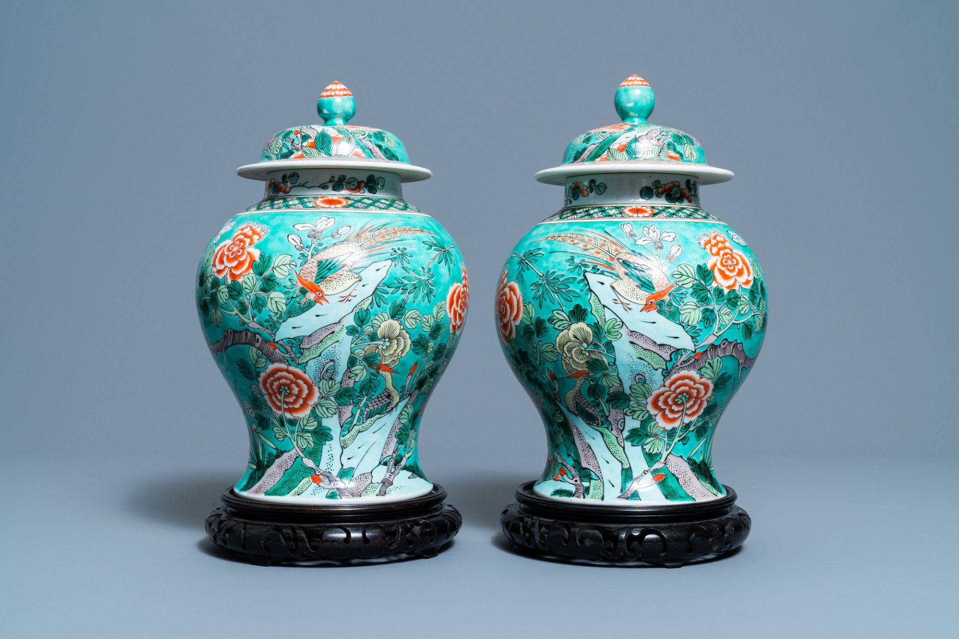 A pair of Chinese turquoise-ground famille verte vases and covers, 19th C.